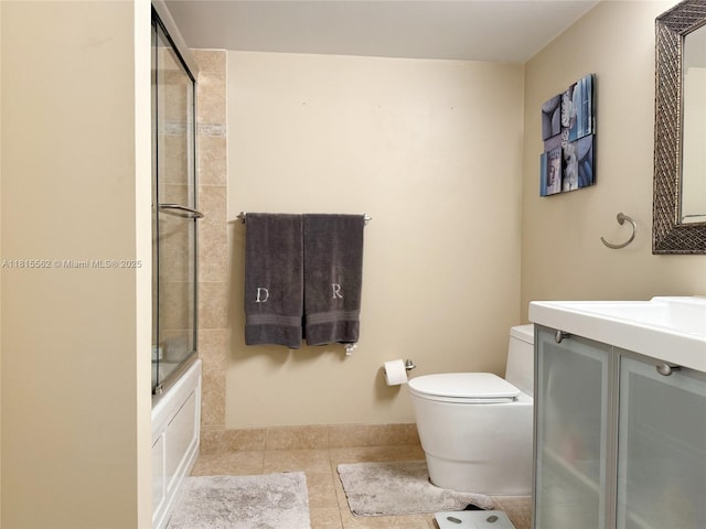 800 Parkview Dr Unit 820, Hallandale Beach, FL 33009 - full bath featuring tile patterned floors, toilet, vanity, and enclosed tub / shower combo