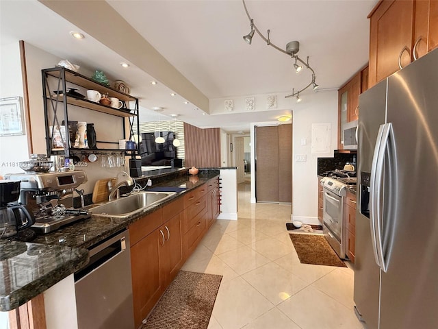 800 Parkview Dr Unit 820, Hallandale Beach, FL 33009 - kitchen featuring stainless steel appliances, a sink, brown cabinets, light tile patterned floors, and tasteful backsplash