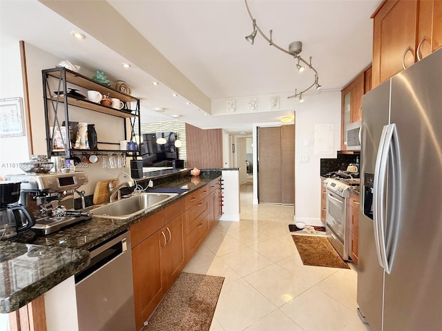800 Parkview Dr Unit 820, Hallandale Beach, FL 33009 - kitchen featuring stainless steel appliances, a sink, brown cabinetry, light tile patterned flooring, and decorative backsplash