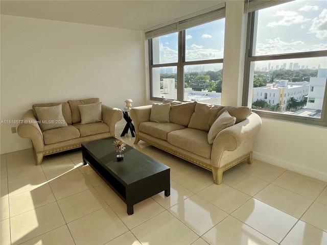 2899 Collins Ave Unit 810, Miami Beach, FL 33140 - living area featuring tile patterned floors, a city view, and baseboards