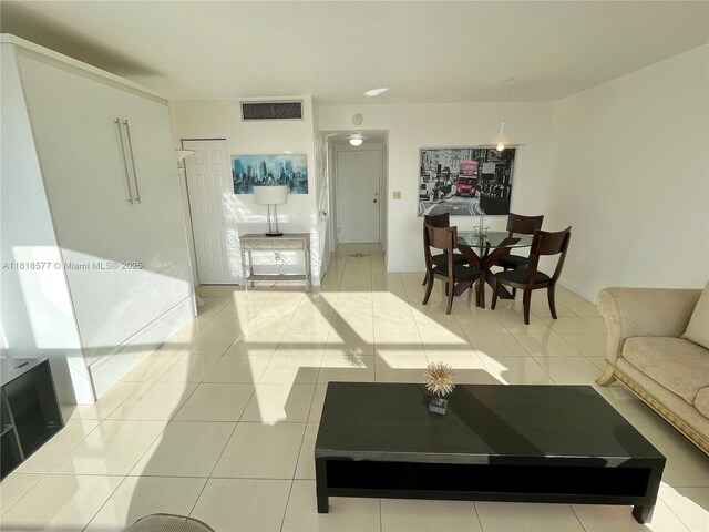 2899 Collins Ave Unit 810, Miami Beach, FL 33140 - living room featuring light tile patterned floors and baseboards