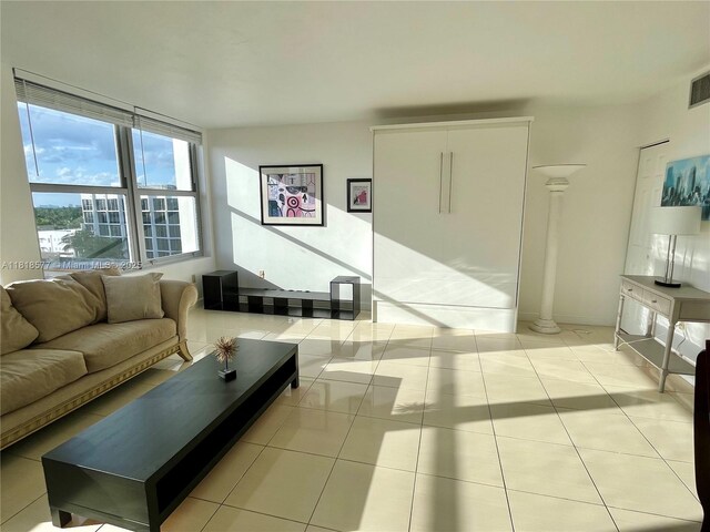 2899 Collins Ave Unit 810, Miami Beach, FL 33140 - living area featuring light tile patterned floors