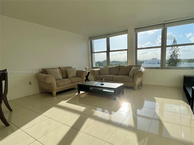 2899 Collins Ave Unit 810, Miami Beach, FL 33140 - living room featuring tile patterned flooring and baseboards