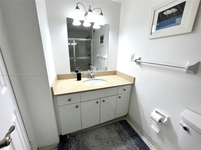 2899 Collins Ave Unit 810, Miami Beach, FL 33140 - bathroom with toilet, a shower stall, and vanity