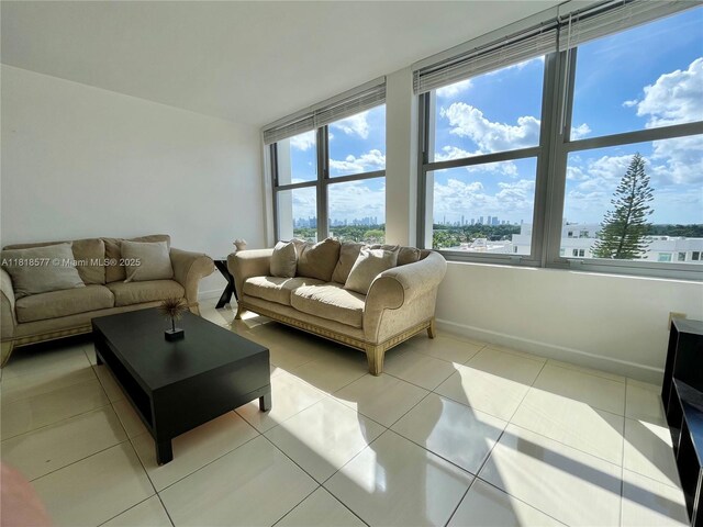2899 Collins Ave Unit 810, Miami Beach, FL 33140 - tiled living room featuring baseboards