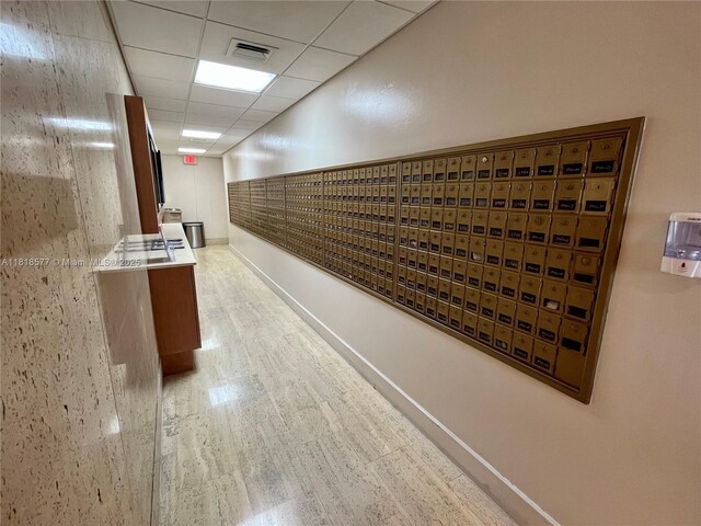 2899 Collins Ave Unit 810, Miami Beach, FL 33140 - view of home's community with mail area and a paneled ceiling