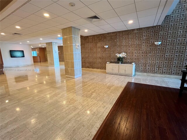 2899 Collins Ave Unit 810, Miami Beach, FL 33140 - interior space featuring decorative columns and a drop ceiling