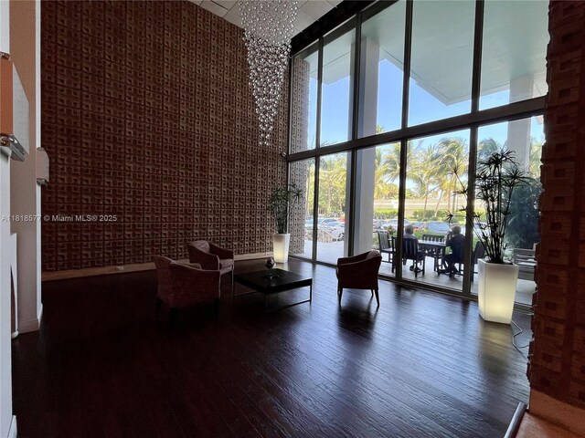 2899 Collins Ave Unit 810, Miami Beach, FL 33140 - common area with a towering ceiling and a wall of windows