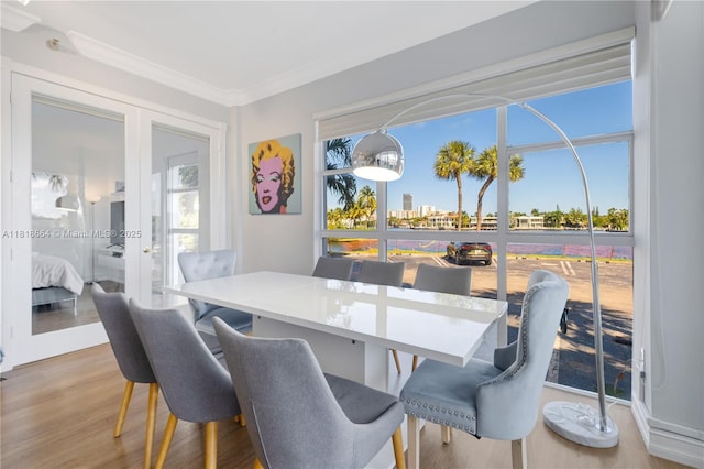 20505 E Country Club Dr Unit 143, Aventura, FL 33180 - dining room featuring french doors, wood finished floors, and ornamental molding