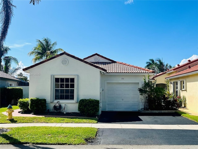 886 SW 180th Ter, Pembroke Pines, FL 33029 - mediterranean / spanish-style house featuring stucco siding, a garage, driveway, and a tile roof