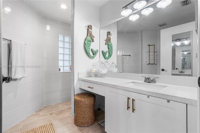 886 SW 180th Ter, Pembroke Pines, FL 33029 - full bathroom featuring vanity, a walk in shower, and wood finished floors