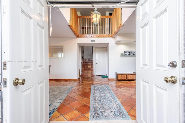 1427 SW 109th Way, Davie, FL 33324 - foyer entrance with tile patterned floors, stairs, and baseboards