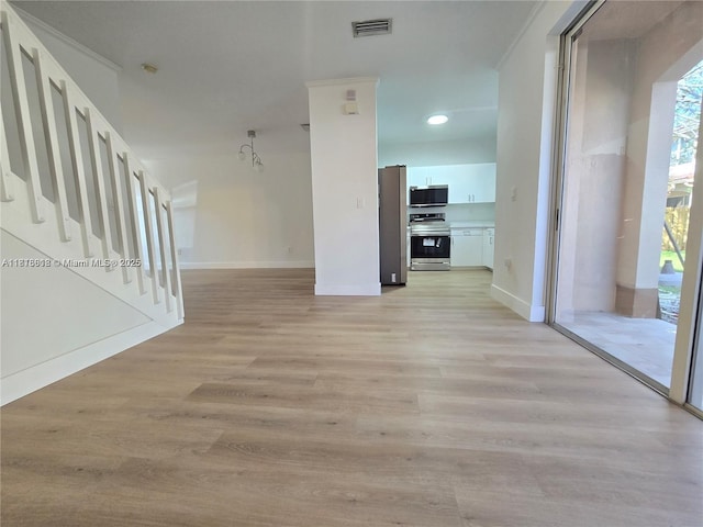 129 Riverwalk Cir Unit 129, Sunrise, FL 33326 - hallway with light wood finished floors, stairway, baseboards, and recessed lighting
