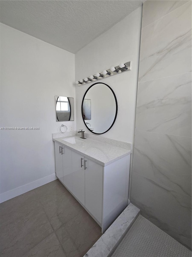 129 Riverwalk Cir Unit 129, Sunrise, FL 33326 - bathroom with vanity, a textured ceiling, and baseboards