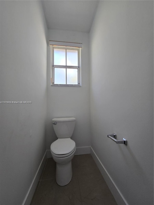 129 Riverwalk Cir Unit 129, Sunrise, FL 33326 - bathroom with toilet, baseboards, and tile patterned floors
