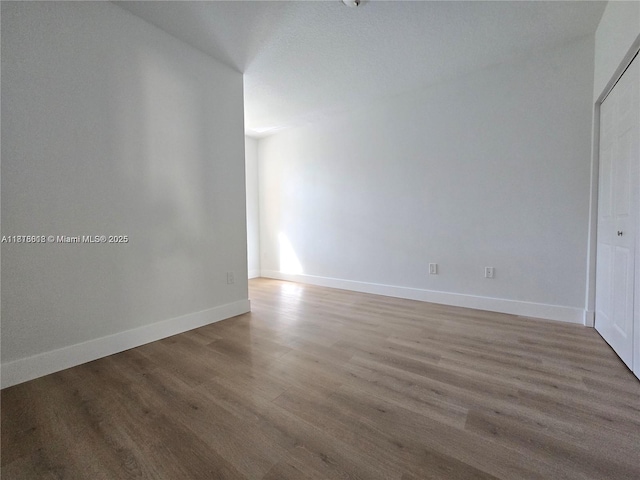 129 Riverwalk Cir Unit 129, Sunrise, FL 33326 - spare room with wood finished floors and baseboards