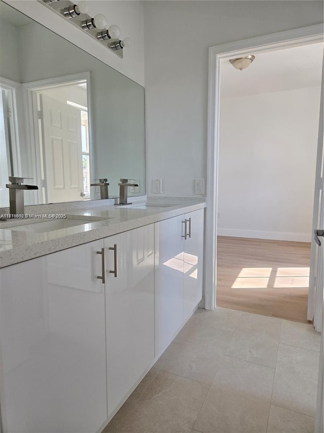 129 Riverwalk Cir Unit 129, Sunrise, FL 33326 - bathroom with vanity, tile patterned floors, and baseboards