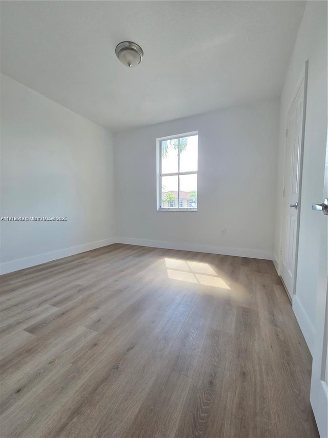 129 Riverwalk Cir Unit 129, Sunrise, FL 33326 - spare room with wood finished floors and baseboards