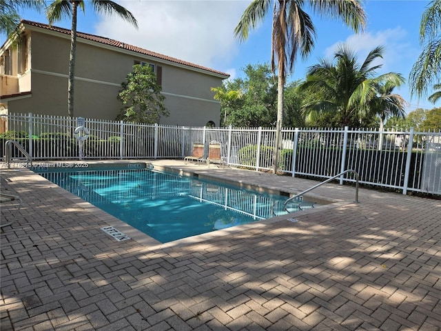 129 Riverwalk Cir Unit 129, Sunrise, FL 33326 - community pool featuring a patio area and a sink
