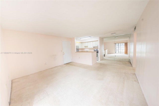 18785 NW 62nd Ave Unit 106, Hialeah, FL 33015 - unfurnished living room with light colored carpet