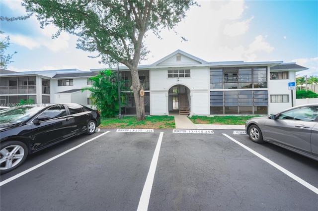 18785 NW 62nd Ave Unit 106, Hialeah, FL 33015 - view of front of home with uncovered parking