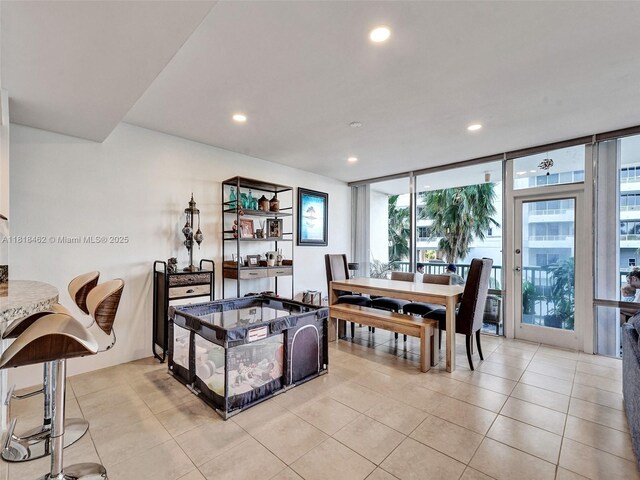 1408 Brickell Bay Dr Unit 411, Miami, FL 33131 - dining space featuring recessed lighting, a wall of windows, and light tile patterned flooring