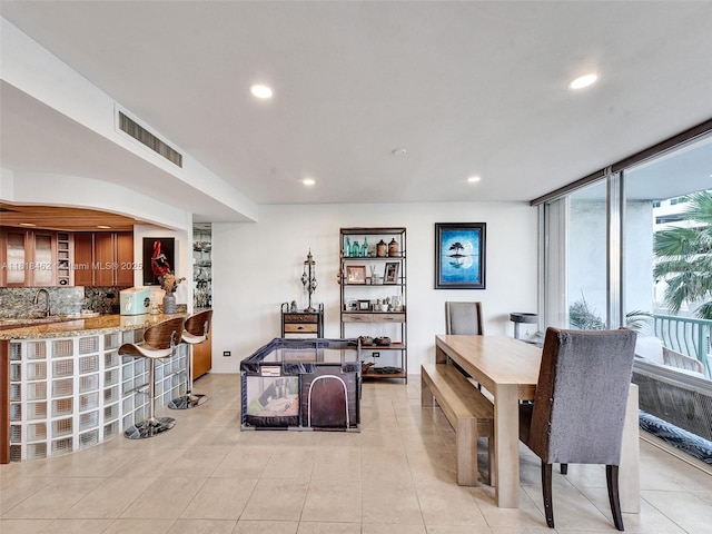 1408 Brickell Bay Dr Unit 411, Miami, FL 33131 - dining area featuring bar with sink, recessed lighting, and light tile patterned flooring