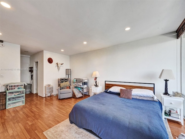 1408 Brickell Bay Dr Unit 411, Miami, FL 33131 - bedroom with wood finished floors and recessed lighting