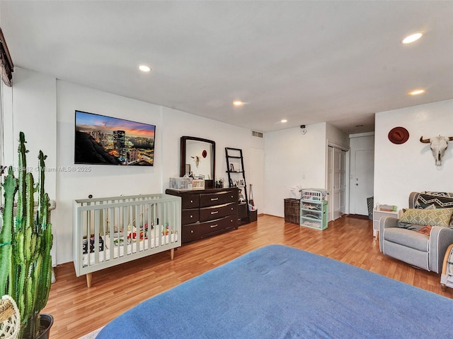 1408 Brickell Bay Dr Unit 411, Miami, FL 33131 - bedroom featuring wood finished floors and recessed lighting