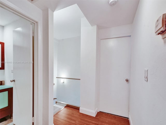 1408 Brickell Bay Dr Unit 411, Miami, FL 33131 - hall with wood finished floors and baseboards