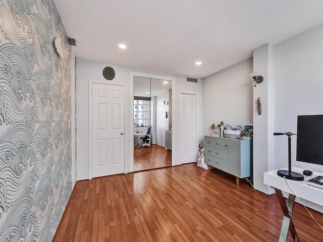 1408 Brickell Bay Dr Unit 411, Miami, FL 33131 - bedroom featuring light wood-style floors, an office area, and recessed lighting