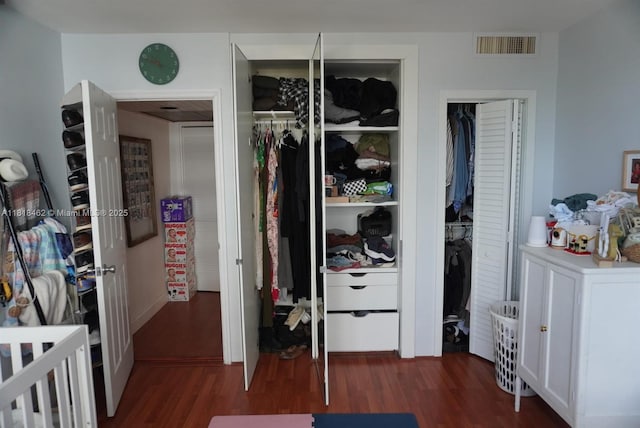 1408 Brickell Bay Dr Unit 411, Miami, FL 33131 - bedroom with dark wood-style floors