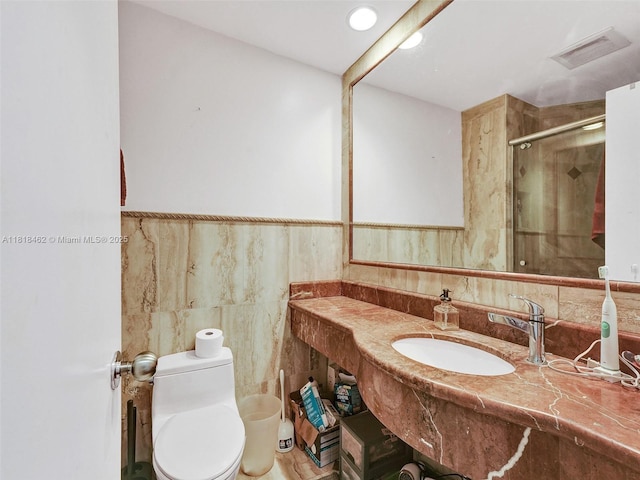 1408 Brickell Bay Dr Unit 411, Miami, FL 33131 - full bathroom featuring a shower stall, vanity, and tile walls