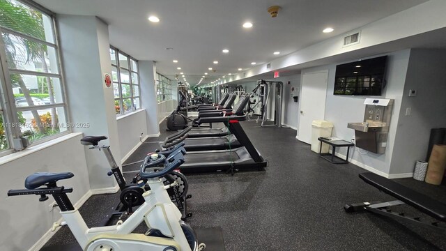 1408 Brickell Bay Dr Unit 411, Miami, FL 33131 - exercise room with baseboards and recessed lighting