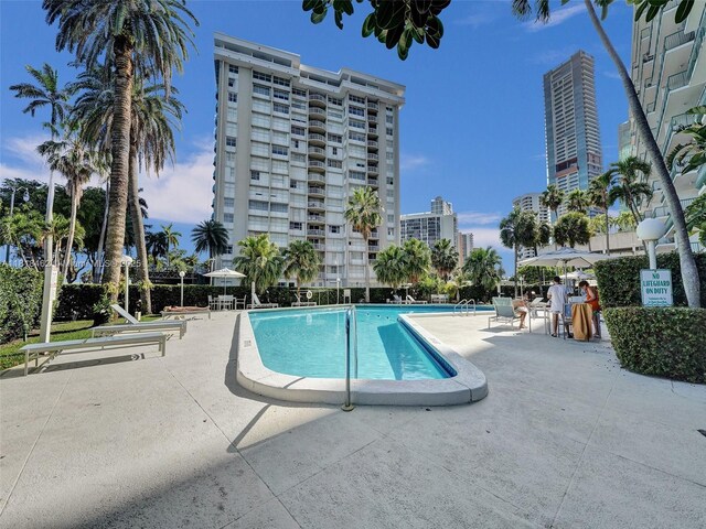1408 Brickell Bay Dr Unit 411, Miami, FL 33131 - community pool with a patio and a city view