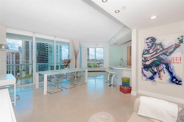480 NE 30th St Unit 1505, Miami, FL 33137 - dining area with light tile patterned flooring, a wall of windows, and recessed lighting