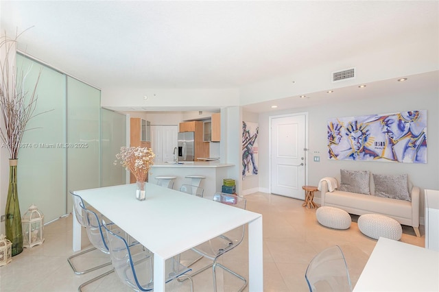 480 NE 30th St Unit 1505, Miami, FL 33137 - dining space featuring light tile patterned floors and recessed lighting