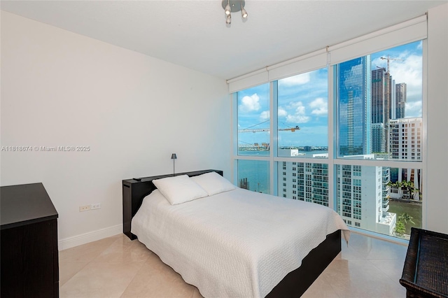 480 NE 30th St Unit 1505, Miami, FL 33137 - bedroom with a wall of windows and a view of city