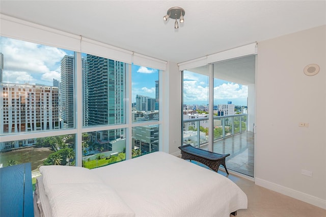 480 NE 30th St Unit 1505, Miami, FL 33137 - tiled bedroom featuring floor to ceiling windows, access to outside, and a view of city