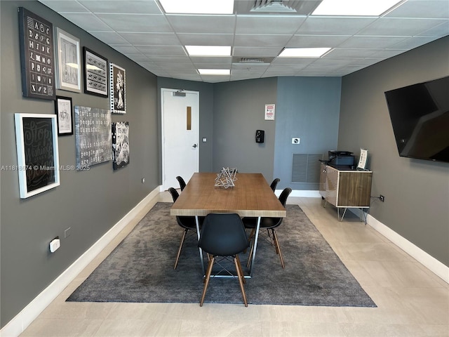 480 NE 30th St Unit 1505, Miami, FL 33137 - dining room featuring a drop ceiling and baseboards