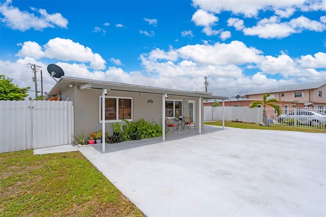 810 E 9th Pl, Hialeah, FL 33010 - view of front of home featuring stucco siding and a patio area