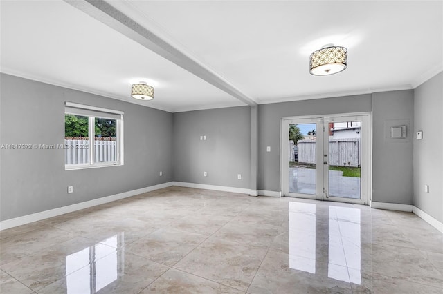 810 E 9th Pl, Hialeah, FL 33010 - spare room with plenty of natural light, ornamental molding, baseboards, and french doors