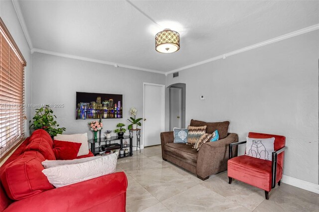810 E 9th Pl, Hialeah, FL 33010 - living area with crown molding, arched walkways, and light marble finish floors
