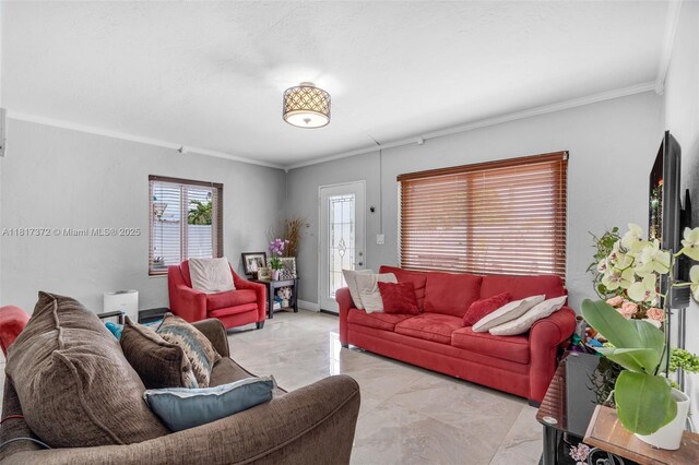 810 E 9th Pl, Hialeah, FL 33010 - living room featuring marble look tile flooring and ornamental molding