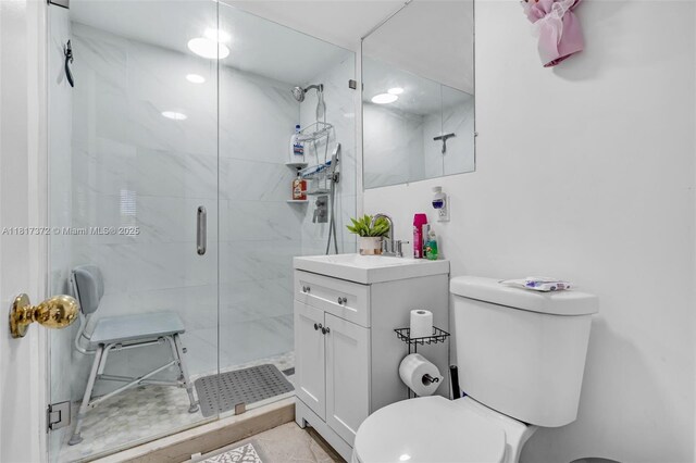 810 E 9th Pl, Hialeah, FL 33010 - bathroom with toilet, vanity, and a stall shower