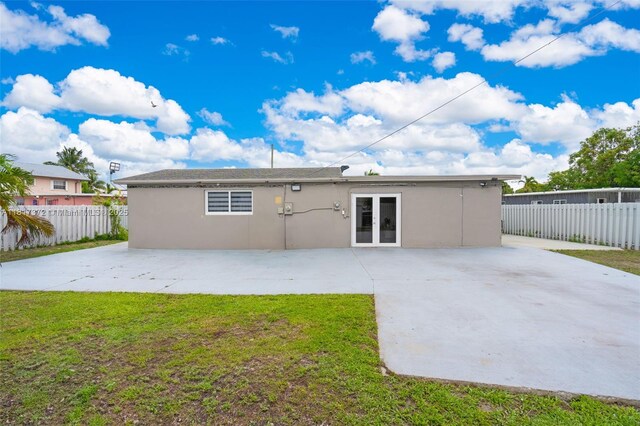 810 E 9th Pl, Hialeah, FL 33010 - rear view of house with a patio area, stucco siding, and french doors