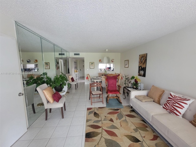 9235 Lagoon Pl Unit 403, Davie, FL 33324 - living room with a textured ceiling and light tile patterned floors