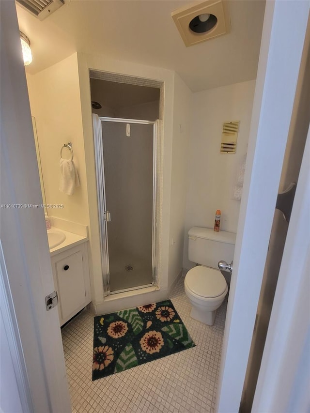 9235 Lagoon Pl Unit 403, Davie, FL 33324 - bathroom with tile patterned floors, toilet, a shower stall, and vanity