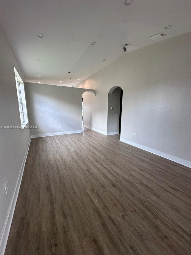 1707 NW 78th Way, Pembroke Pines, FL 33024 - unfurnished room featuring wood finished floors, arched walkways, and recessed lighting