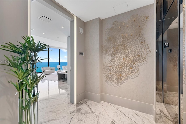 15701 Collins Ave Unit 3101, Sunny Isles Beach, FL 33160 - bathroom featuring marble tiled flooring, elevator, and a water view